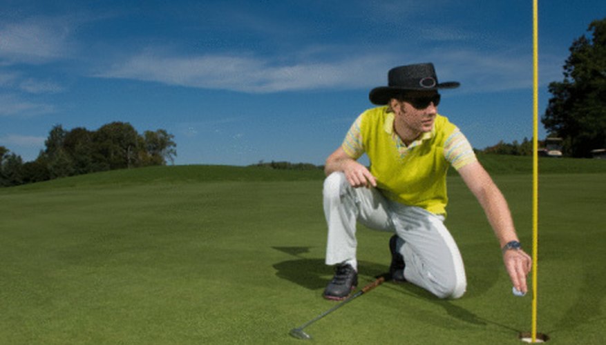Photo Credit: Jupiterimages/Photos.com/Getty Images Cheating in a golf game is an unethical activity.