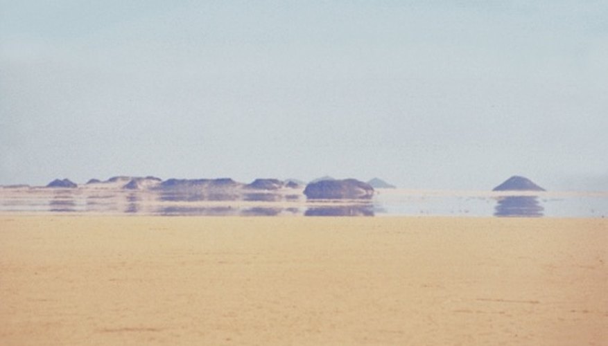 Photo Credit: Jupiterimages/Photos.com/Getty Images A desert is a vast expanse of sand.