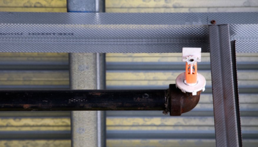 Photo Credit: Jupiterimages/Photos.com/Getty Images These days, black iron pipe is made from a mild steel.