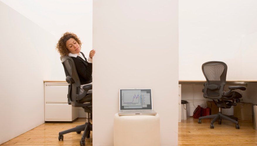 Photo Credit: Jupiterimages/Comstock/Getty Images The cubicle can range in sizes from large to small.