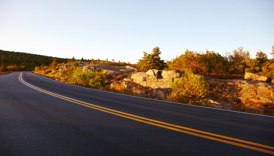 Photo Credit: Thomas Northcut/Photodisc/Getty Images Road material is a factor in formulating the rate of speed.