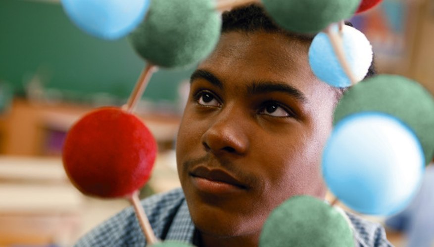 Photo Credit: Comstock/Comstock/Getty Images Color Styrofoam balls represent different parts of the atom.