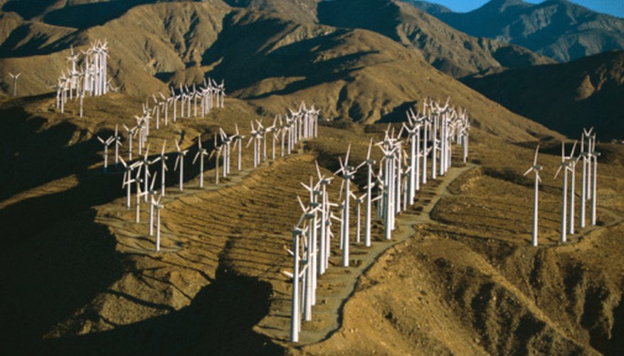 Photo Credit: Jupiterimages/Photos.com/Getty Images Wind farms are often situated along mountain passes.
