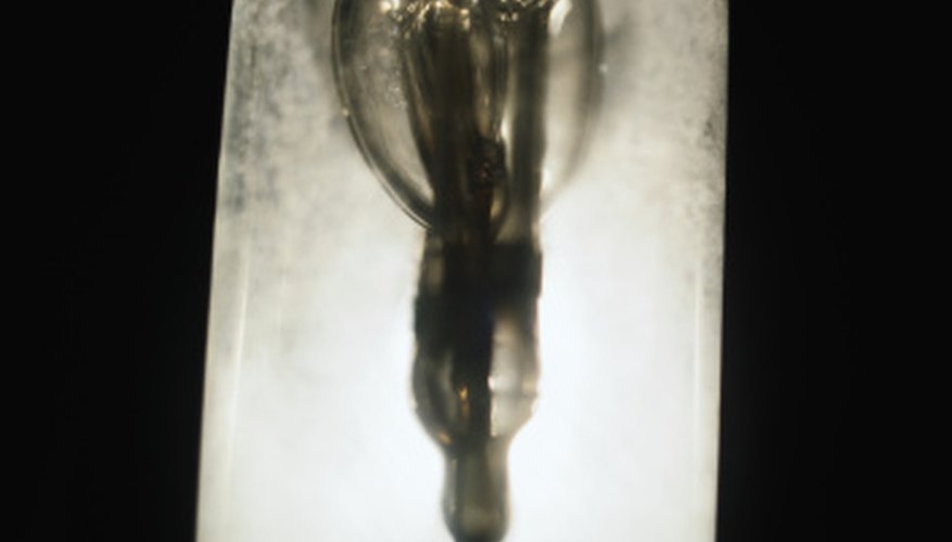 Photo Credit: Ryan McVay/Stockbyte/Getty Images The photoelectric effect was investigated by shining light on a metal surface in a vacuum.