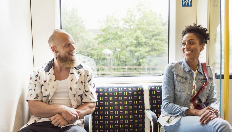 Man and woman flirting on a train. Man and woman flirting on a train.