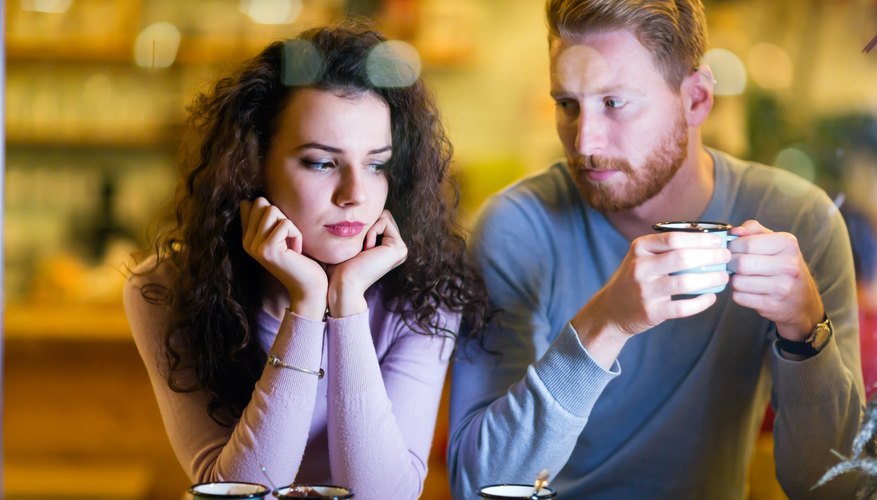 Couple having a bad time on a date. Couple having a bad time on a date.