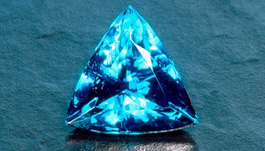 Paraiba tourmalines are a clear, ocean blue but will also emit green Paraiba tourmalines are a clear, ocean blue but will also emit green