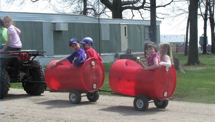 Trailers made from plastic barrels. Trailers made from plastic barrels.
