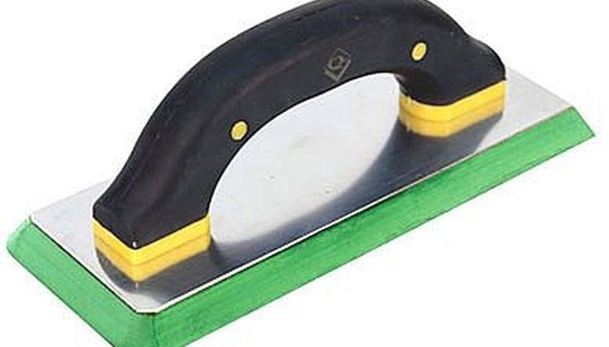 Apply the grout to the concrete floor. Apply the grout to the concrete floor.