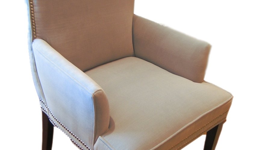 A fully upholstered dining arm chair in the parsons style. A fully upholstered dining arm chair in the parsons style.