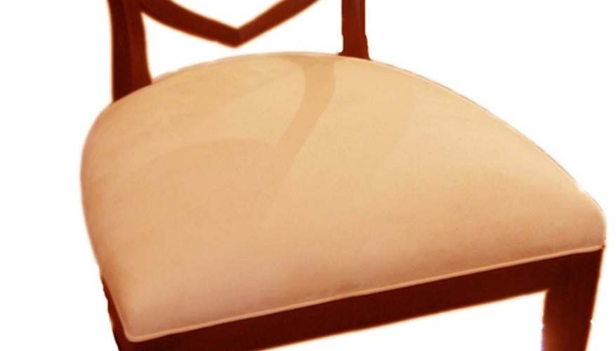 A side chair with a wood back and upholstered seat. A side chair with a wood back and upholstered seat.
