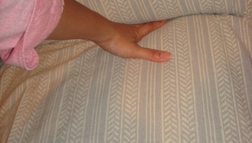 Tuck the fabric into the creases. Tuck the fabric into the creases.