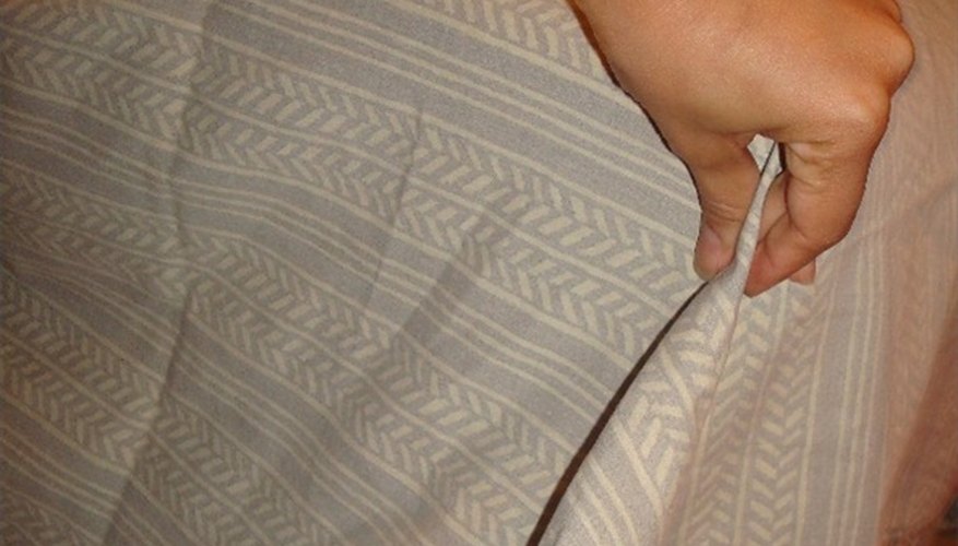 Pinch up the extra fabric at corners and cut off the extra layers. Pinch up the extra fabric at corners and cut off the extra layers.