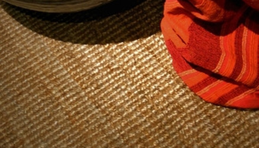 Natural fiber rugs add texture to a modern dining room. Natural fiber rugs add texture to a modern dining room.