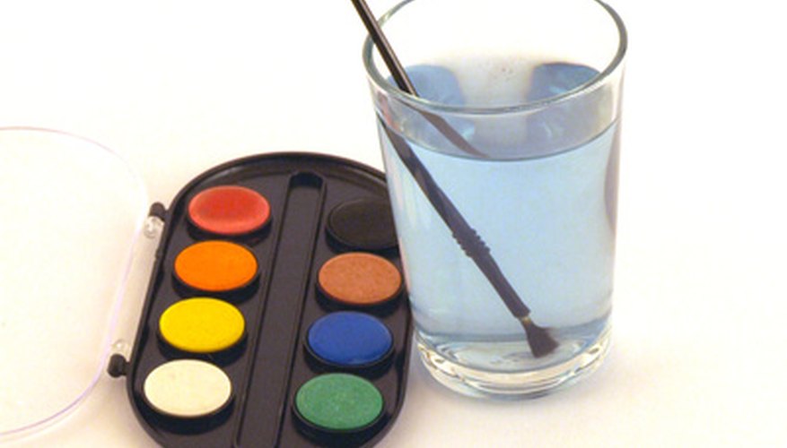 Photo Credit: case of water color and brush in water image by timur1970 from <a href='http://www.fotolia.com'>Fotolia.com</a> The speed and wavelength of sound is faster in water than in air