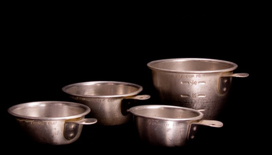 Photo Credit: vintage measuring cups image by Scott Williams from <a href='http://www.fotolia.com'>Fotolia.com</a> Challenge kindergartners to look at and read measurement markings.