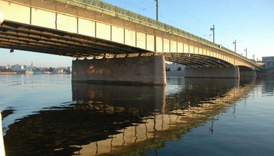 Photo Credit: bridge image by Svetlana Nikonova from <a href='http://www.fotolia.com'>Fotolia.com</a> Resins are used in place of paint for extended longevity.