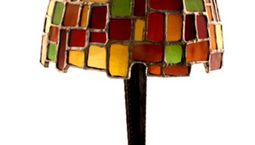 The finial is the topmost piece of the lamp, securing the shade. The finial is the topmost piece of the lamp, securing the shade.