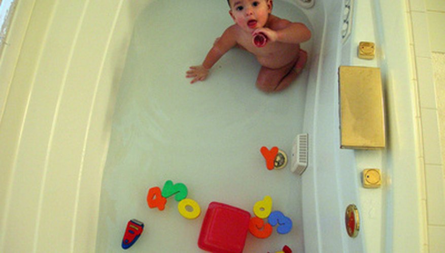 Containers and cups in the tub teach measurement. Containers and cups in the tub teach measurement.