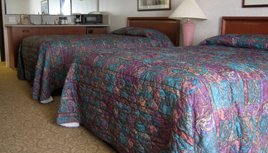 Photo Credit: hotel room image by Albert Lozano from <a href='http://www.fotolia.com'>Fotolia.com</a> Guestroom attendants ensure that every guestroom is spotless.