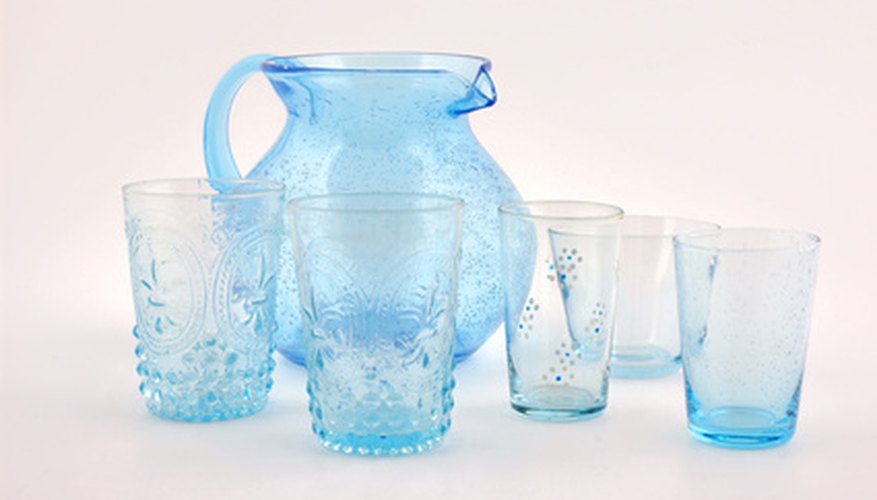 Photo Credit: set of blue glasses and water pitcher image by robert paul van beets from <a href='http://www.fotolia.com'>Fotolia.com</a> Let children use everyday objects to practice making estimates about capacity.