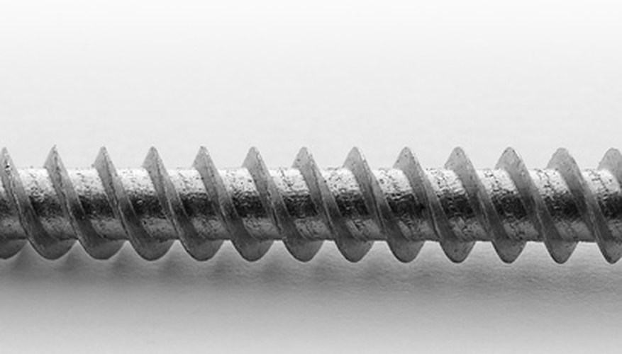 Photo Credit: screw image by Pefkos from <a href='http://www.fotolia.com'>Fotolia.com</a> Extrusion is used to create objects from liquid metals and plastics.