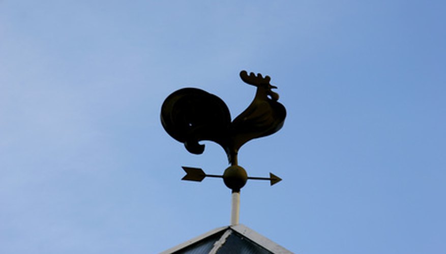 Photo Credit: silhouette of weathercock over blue sky image by Alena Yakusheva from <a href='http://www.fotolia.com'>Fotolia.com</a> Wind is influenced by air preasure and temperature.