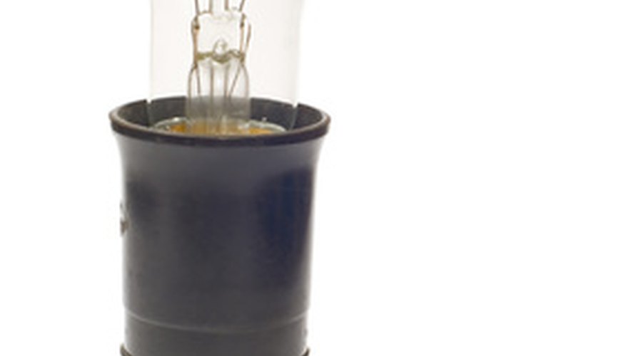 The light bulb screws into the lamp's socket. The light bulb screws into the lamp's socket.