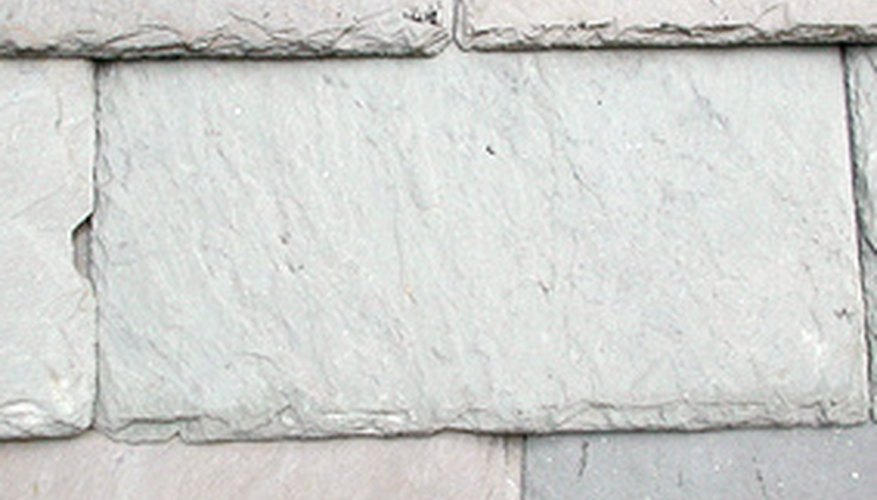 Repairing a slate roof requires a skillful hand. Repairing a slate roof requires a skillful hand.