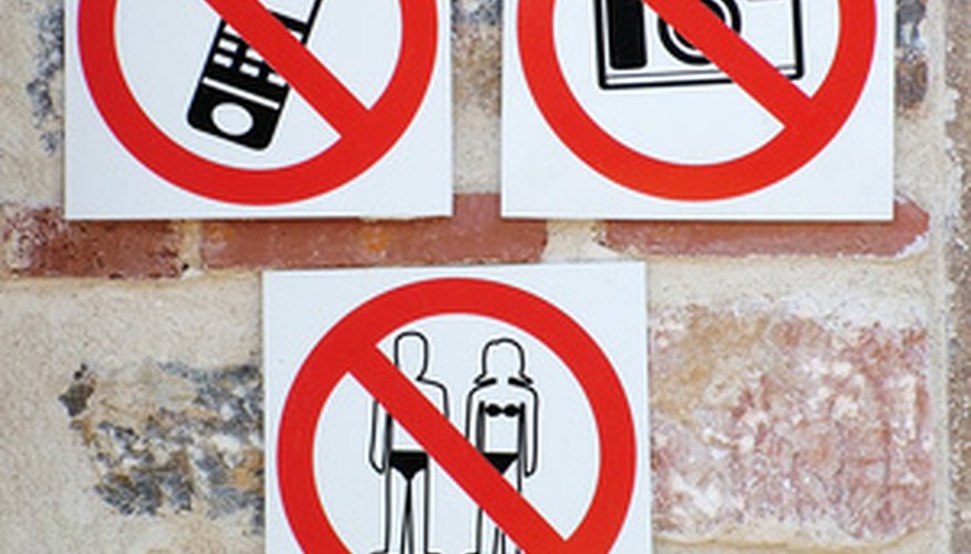 Photo Credit: polite signs image by drx from <a href='http://www.fotolia.com'>Fotolia.com</a> Attaching magnetic signs to aluminum surfaces is simple using the right adhesives.
