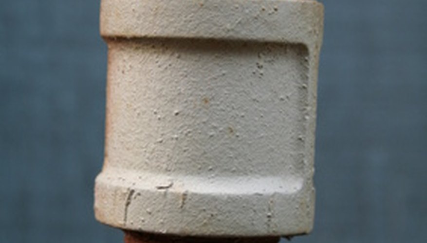 Photo Credit: rusty metal pipe 2 image by jbattx from <a href='http://www.fotolia.com'>Fotolia.com</a> Pipes can be threaded with a straight or tapered thread.
