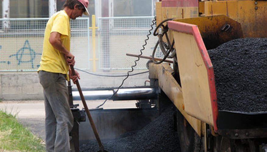 Photo Credit: asphalt image by dinostock from <a href='http://www.fotolia.com'>Fotolia.com</a> Surface area, thickness and the density of asphalt paving material are used to compute the required quantity of asphalt.