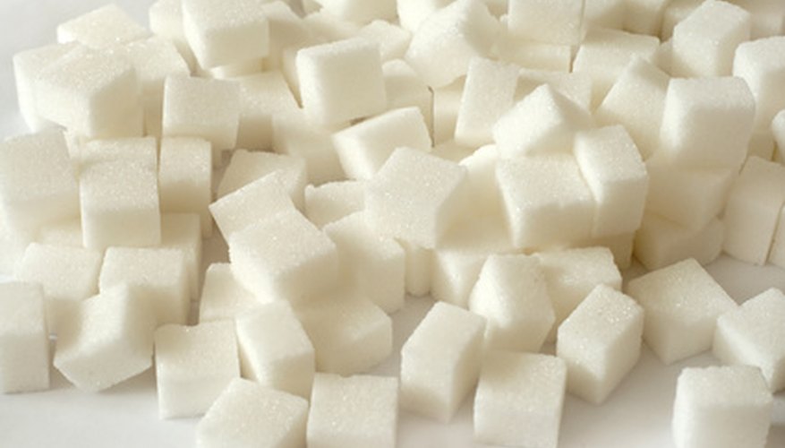 Photo Credit: sugar image by Olga Shelego from <a href='http://www.fotolia.com'>Fotolia.com</a> Temperature is key to preparing a supersaturated sugar solution.