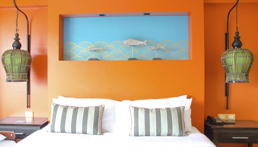 Modern master bedroom with orange and blue accents Modern master bedroom with orange and blue accents