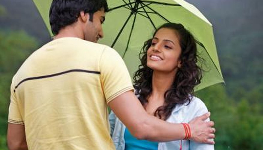 couple looking at each other in the rain couple looking at each other in the rain