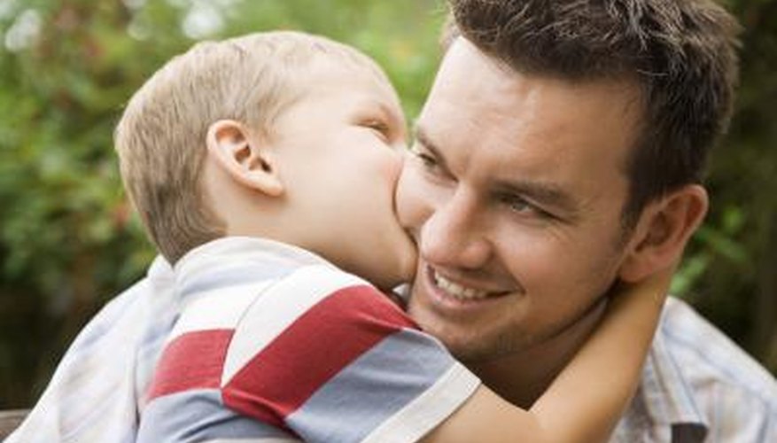 son kissing his father on the cheek son kissing his father on the cheek