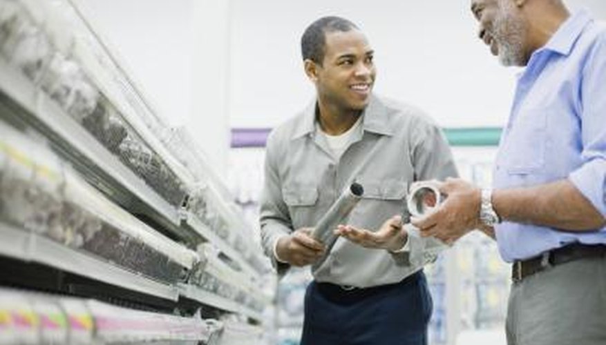 Men shopping in hardware store for supplies Men shopping in hardware store for supplies