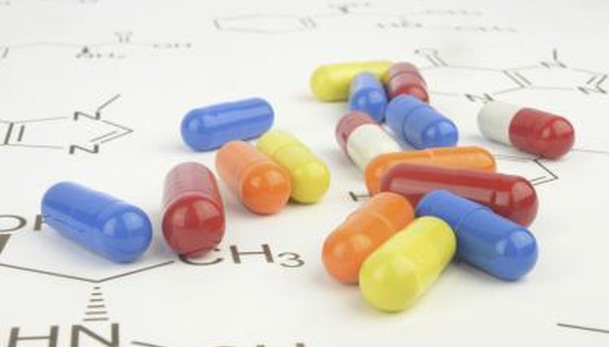 Close up of pills on a scientific chart. Close up of pills on a scientific chart.