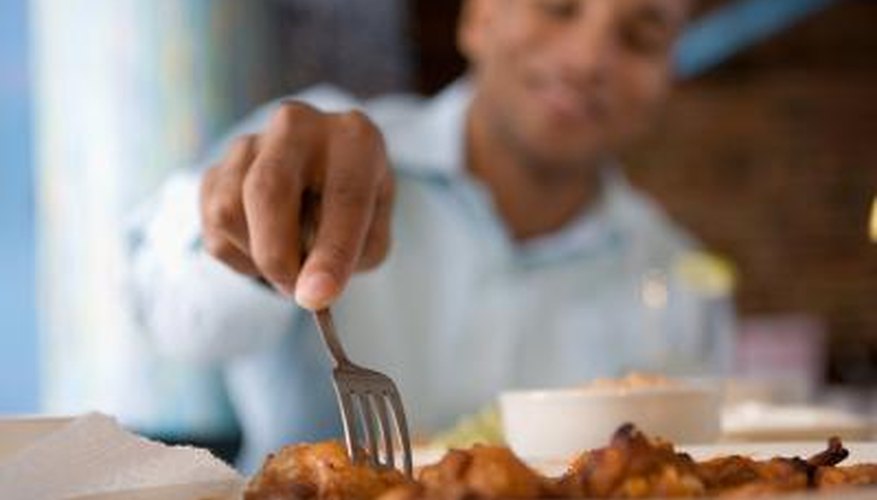Man eating chicken Man eating chicken