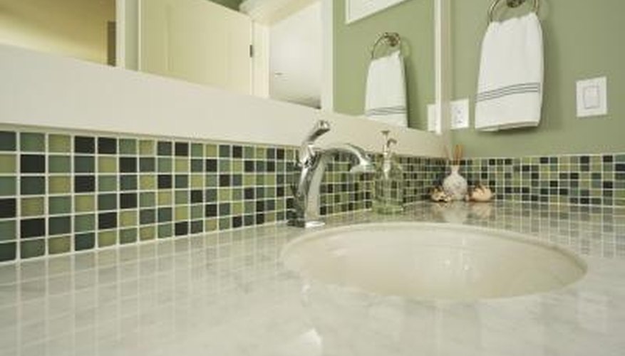 Colorful green tiling around sink Colorful green tiling around sink