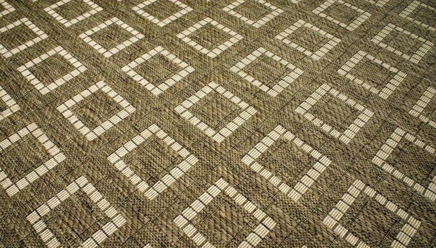 Close-up of carpet squares arranged on a floor. Close-up of carpet squares arranged on a floor.
