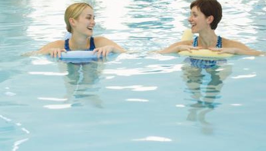 Woman swimming in pool Woman swimming in pool