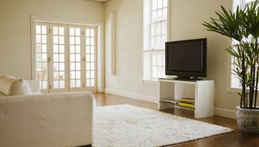 Dark flooring offers visually pleasing color contrast against white furnishings. Dark flooring offers visually pleasing color contrast against white furnishings.