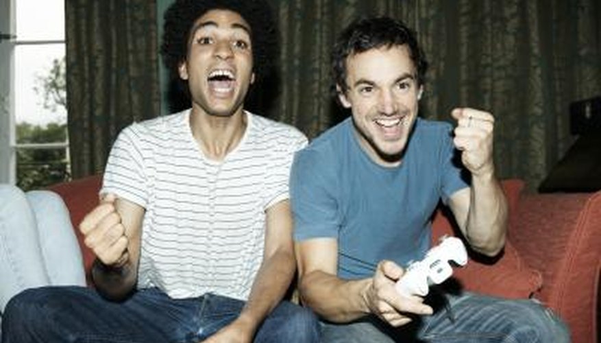 man playing video games with woman's brother man playing video games with woman's brother