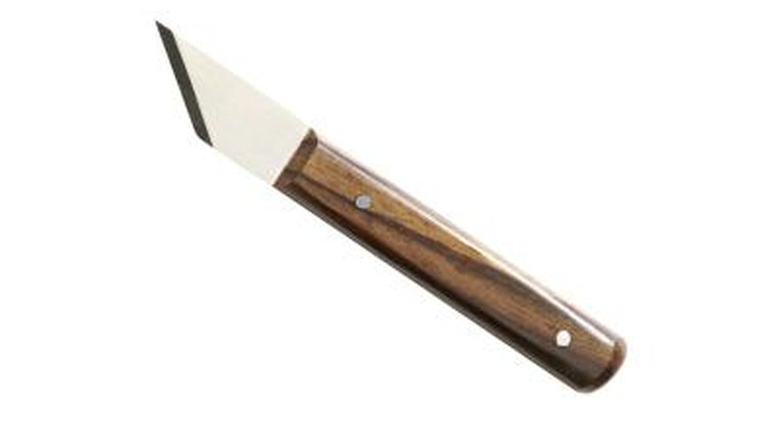 A utility knife's sharp point makes twisting out air holes easy. A utility knife's sharp point makes twisting out air holes easy.