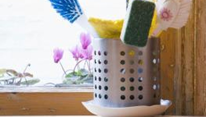 A scrub brush cleans natural grooves and crevices in brick. A scrub brush cleans natural grooves and crevices in brick.