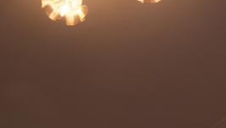 Semi-flush lights hang below a ceiling surface. Semi-flush lights hang below a ceiling surface.