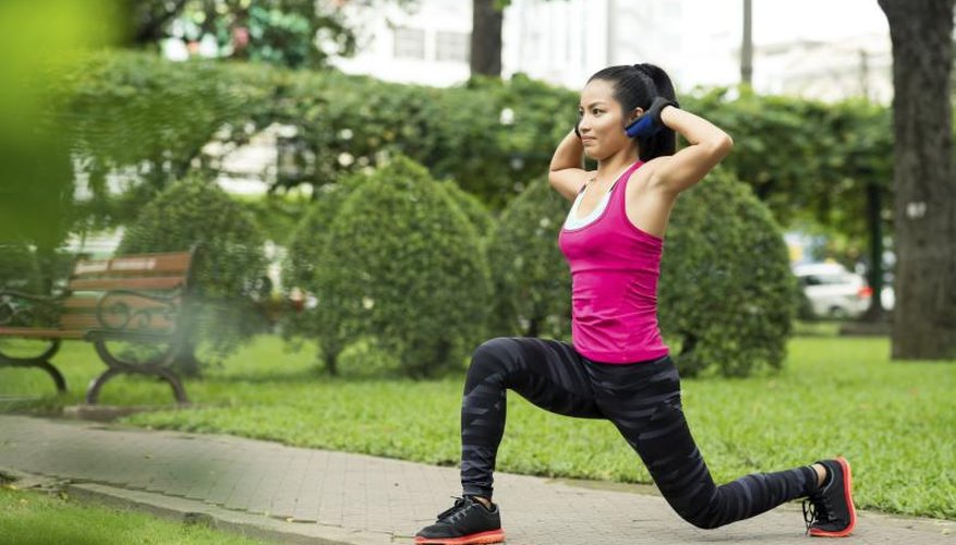 Woman practicing lunges outside. Woman practicing lunges outside.