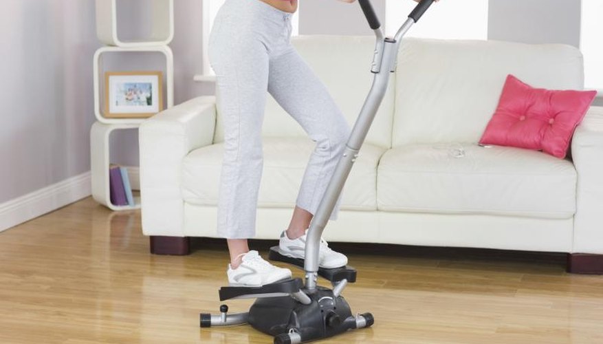 A woman is training on a step machine. A woman is training on a step machine.