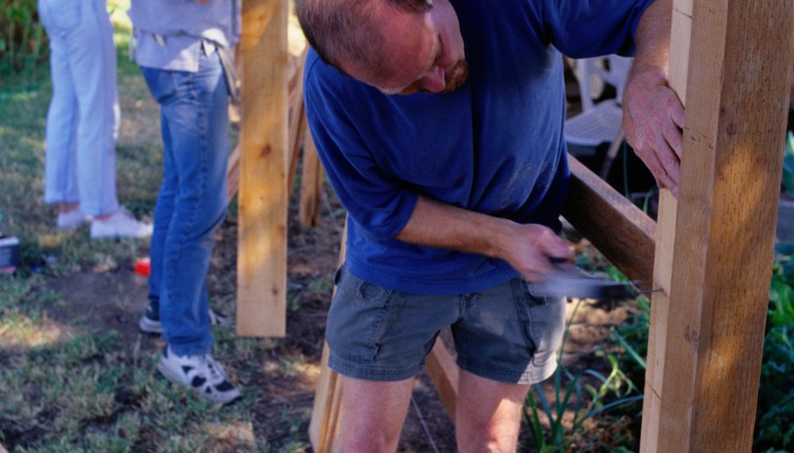 Secure each post with braces while the concrete sets. Secure each post with braces while the concrete sets.